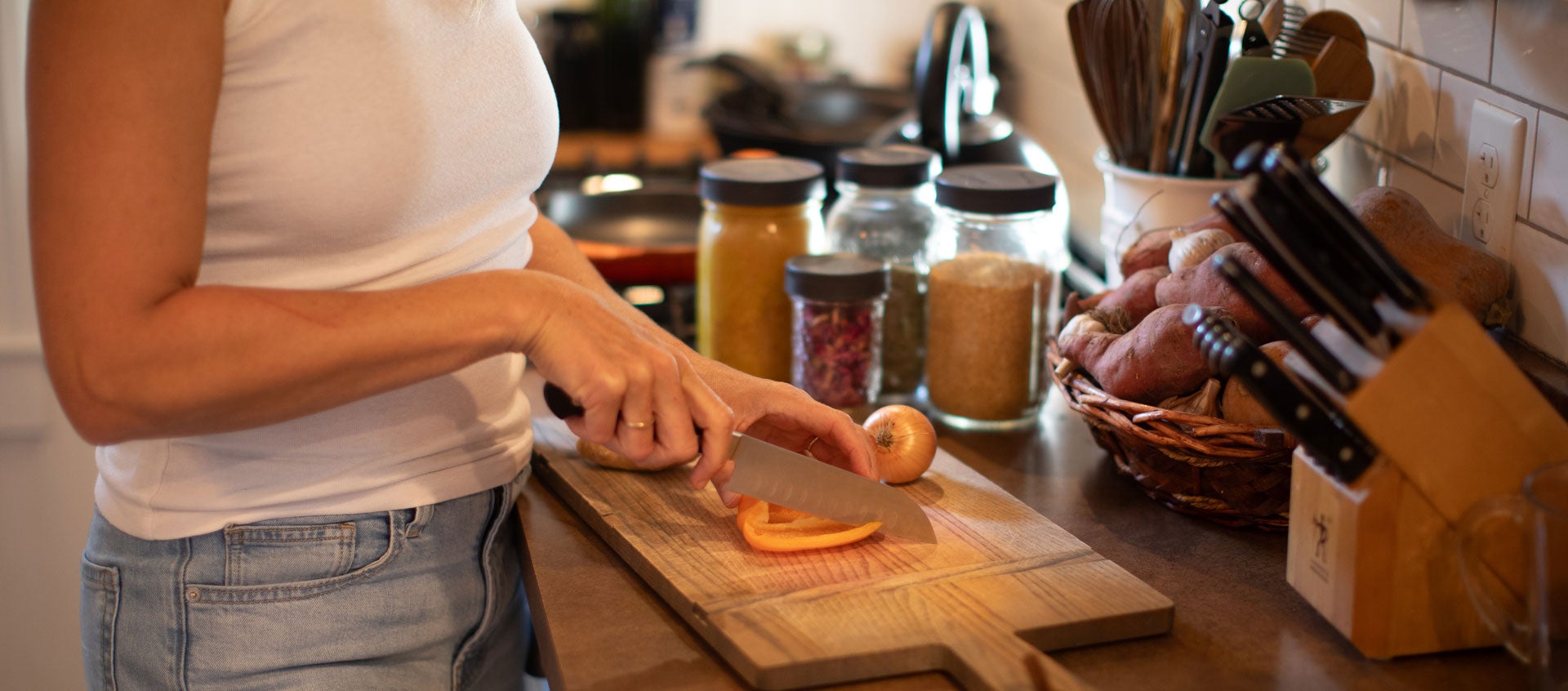 woman chopping pepper