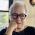 woman with white hair and glasses