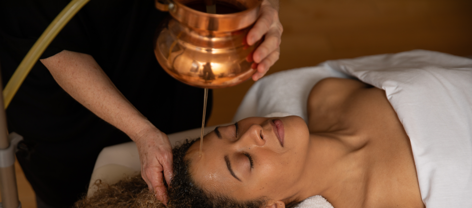 Ayurvedic oil treatment Woman receiving Ayurvedic oil treatment