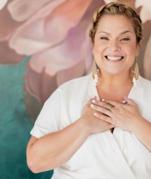 Shannon Kaiser with her hands over her heart